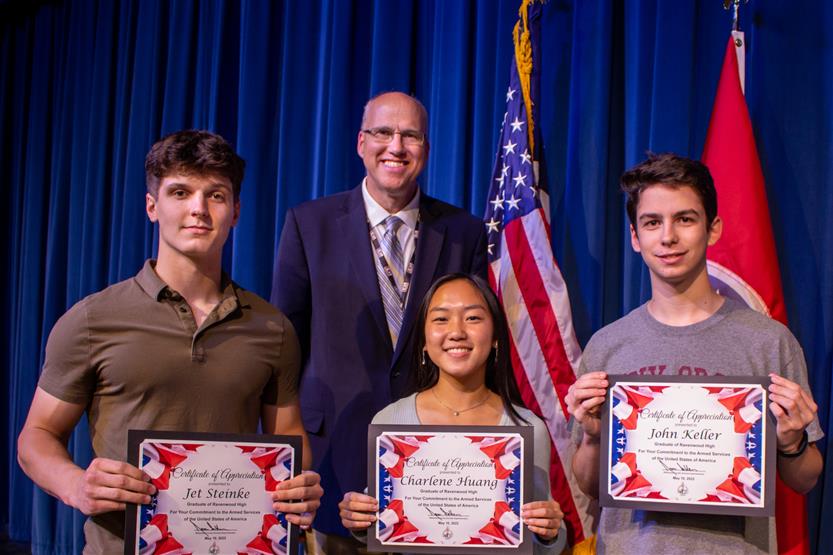 A student is honored for serving in the US Armed Forces after high school